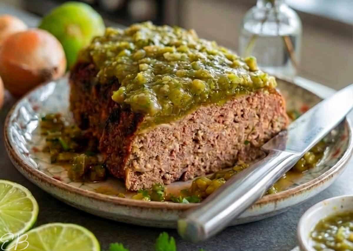 Healthy Gluten-free Mexican Turkey Meatloaf on ceramic plate, cut open to serve