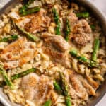 overhead view of dairy free marry me chicken with asparagus, in the pan