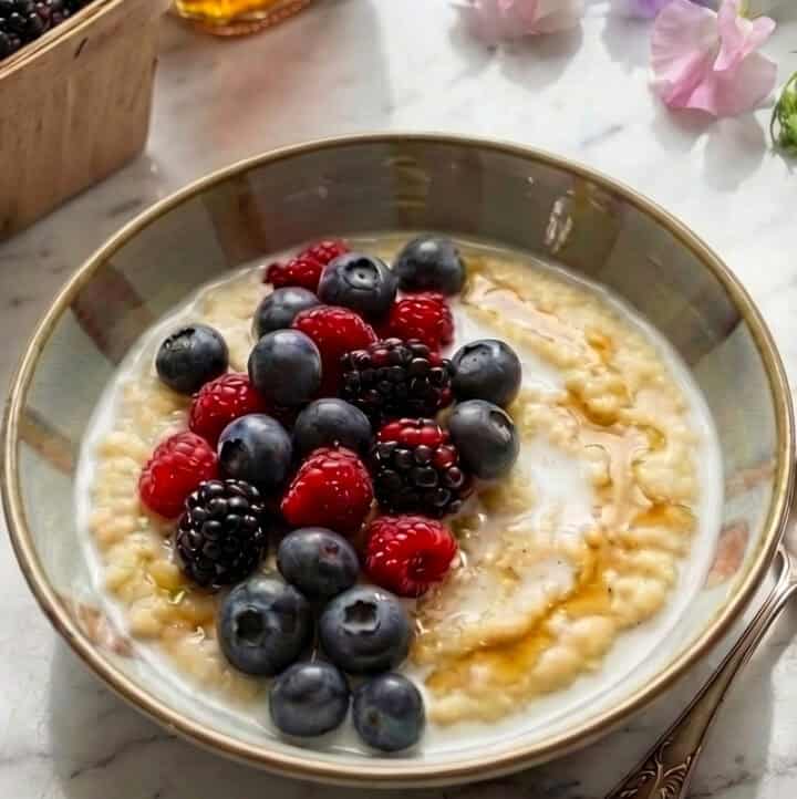 masa porridge breakfast in bowl surrounded by toppings