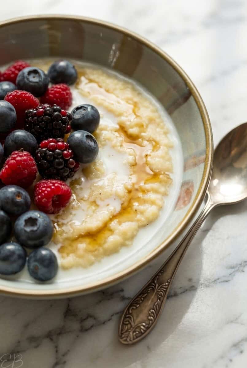 up close bowl of calcium rich masa porridge topped with berries