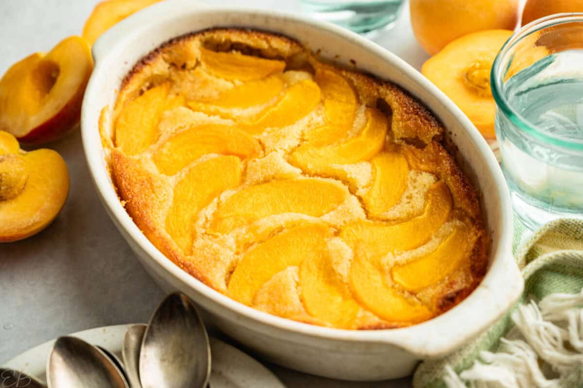 side angle up close view of peach clafoutis cake