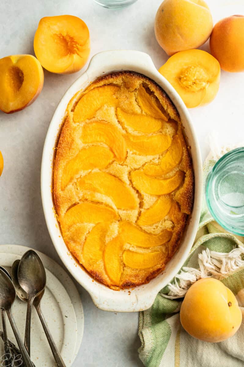 entire peach cake in casserole dish with overhead view