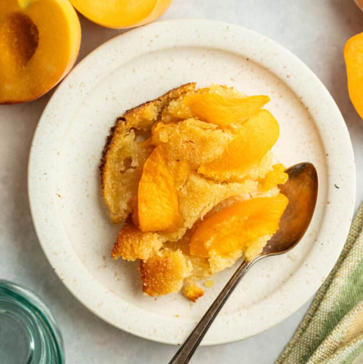 fresh peach cake (clafoutis) served on white plate