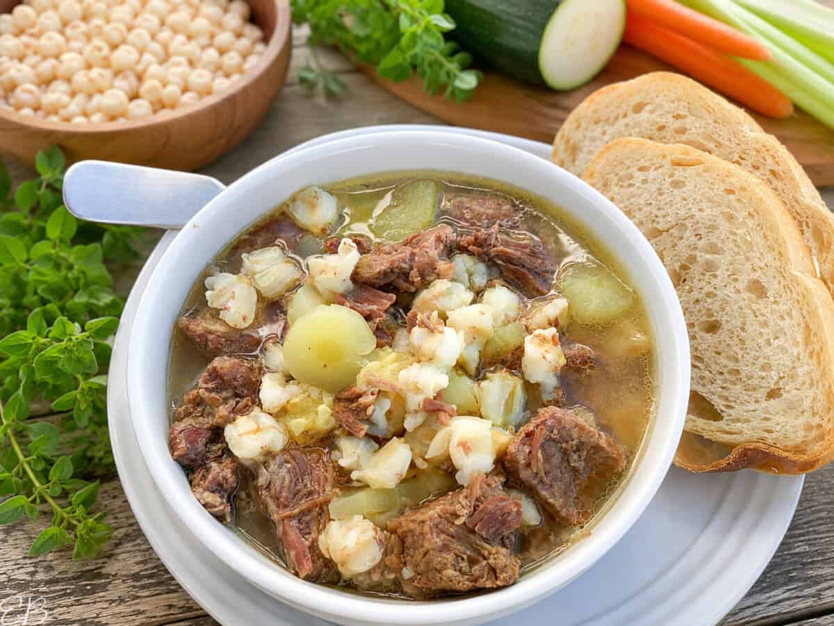 side angle view of Easy Beef Posole Stew with Hominy, showing the ingredients in the background