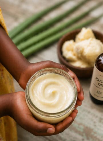 3-Ingredient DIY Hair Detangler for 4C Hair in jar held by girl's hands with ingredients in the background