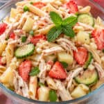 Healthy Chicken Summer Pasta Salad in glass bowl, close up
