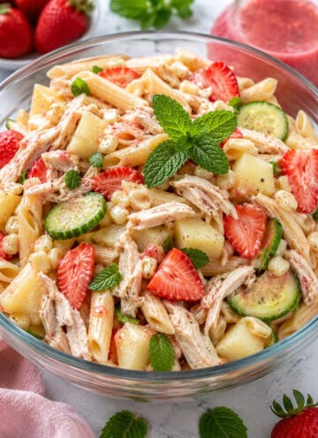 Healthy Chicken Summer Pasta Salad in glass bowl, close up