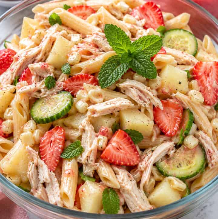Healthy Chicken Summer Pasta Salad in glass bowl, close up