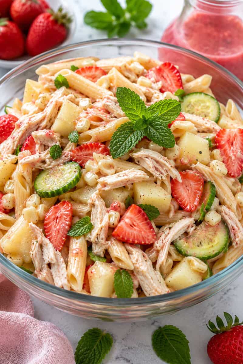 Healthy Chicken Summer Pasta Salad in glass bowl, close up